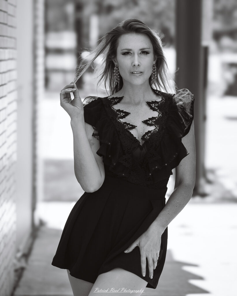 Natural light portrait of a model, photographed on June 28, 2025. She is posed outdoors with soft, flattering lighting, conveying a calm and confident expression.